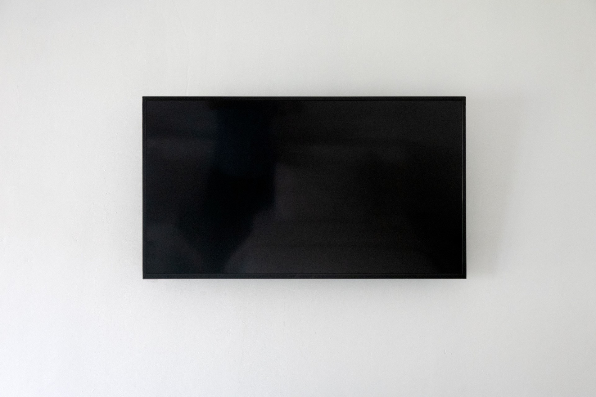Large lcd tv on modern gray wall